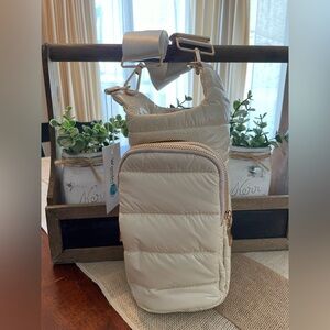 WanderFull  Ivory glossy puffer  Hydrobag w/ solid crossbody strap.